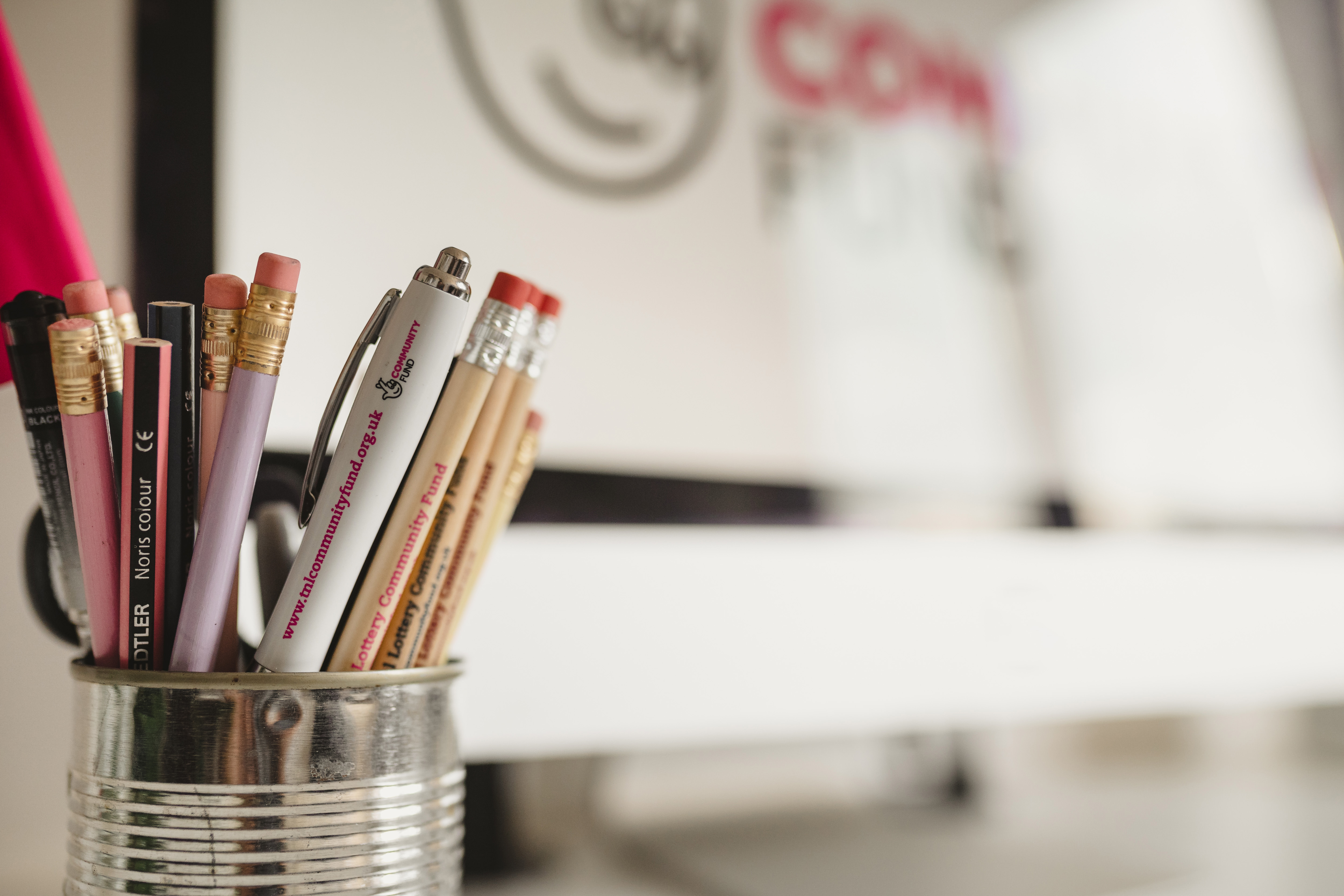 Photo showing pot of pens with The National Lottery Community Fund brand shown